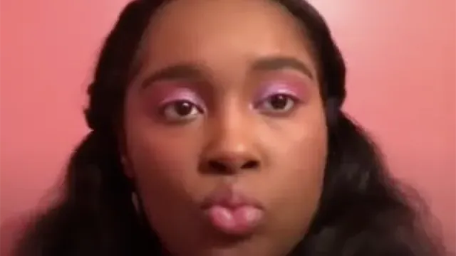 Sydney Williams video still doing a makeup tutorial in Korean
